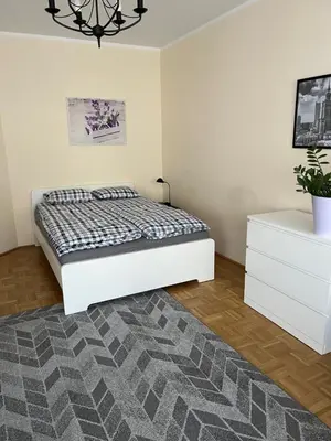 Łóżko lub łóżka w pokoju w obiekcie Apartment Kabaty