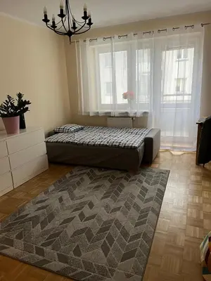 Łóżko lub łóżka w pokoju w obiekcie Apartment Kabaty
