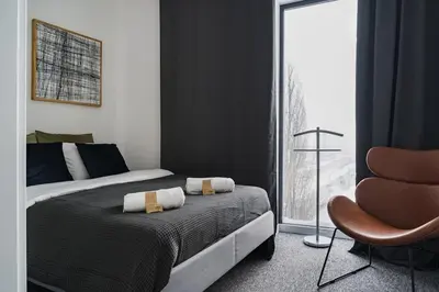 Łóżko lub łóżka w pokoju w obiekcie Warsaw Concierge EXPO XXI