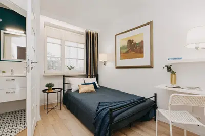 Łóżko lub łóżka w pokoju w obiekcie 23 MGR Rooms Sonata