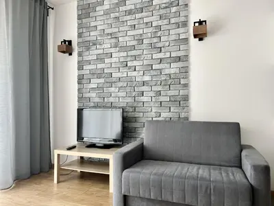 Telewizja i/lub zestaw kina domowego w obiekcie K22 Sky Apartments in the Warsaw