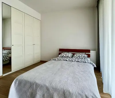 Łóżko lub łóżka w pokoju w obiekcie K22 Sky Apartments in the Warsaw