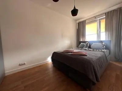 Łóżko lub łóżka w pokoju w obiekcie Gocław 2 rooms Parking Free