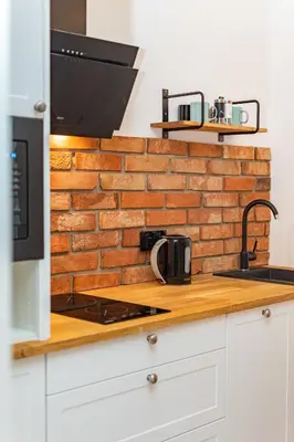 Kuchnia lub aneks kuchenny w obiekcie Nowy Świat 47a by Homeprime