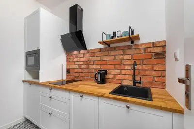 Kuchnia lub aneks kuchenny w obiekcie Nowy Świat 47a by Homeprime