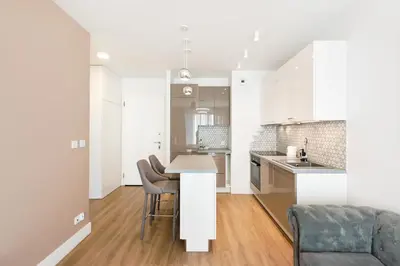 Kuchnia lub aneks kuchenny w obiekcie Wola Bloom Apartment by BookingHost