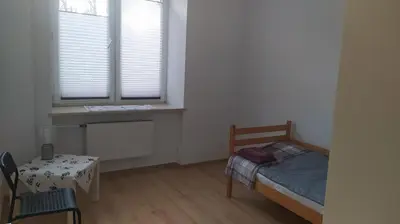 Łóżko lub łóżka w pokoju w obiekcie Apartament Szczęśliwicka