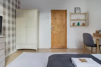 Łóżko lub łóżka w pokoju w obiekcie Warsaw Concierge Wilanowska
