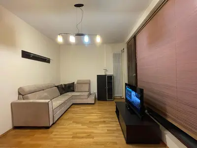 Telewizja i/lub zestaw kina domowego w obiekcie TRITON PARK Apartaments