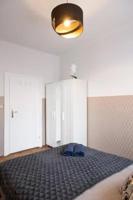 Łóżko lub łóżka w pokoju w obiekcie ClickTheFlat Wilcza 35 City Center Apart Rooms