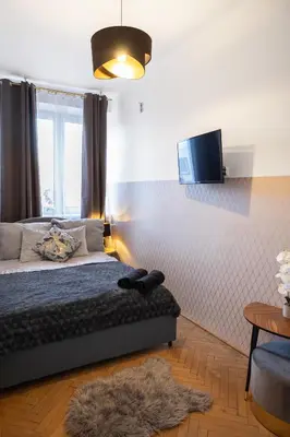 Łóżko lub łóżka w pokoju w obiekcie ClickTheFlat Wilcza 35 City Center Apart Rooms