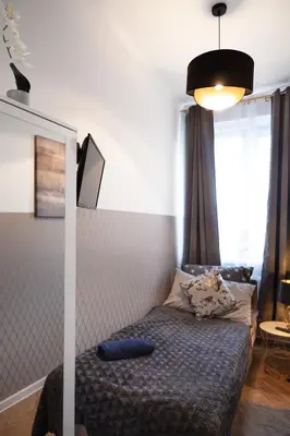 Łóżko lub łóżka w pokoju w obiekcie ClickTheFlat Wilcza 35 City Center Apart Rooms