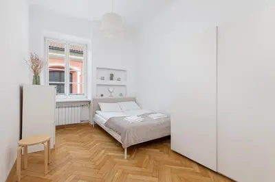 Łóżko lub łóżka w pokoju w obiekcie Stylish Apartment Świętojańska by Noclegi Renters