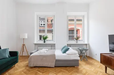 Łóżko lub łóżka w pokoju w obiekcie Stylish Apartment Świętojańska by Noclegi Renters