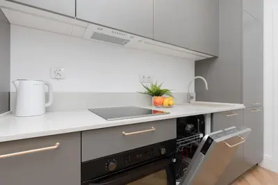 Kuchnia lub aneks kuchenny w obiekcie CityCenter Fashionable Apartment Warsaw by Noclegi Renters