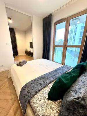 Łóżko lub łóżka w pokoju w obiekcie Rudnickiego, Fort Bema, free parking by Cosmo Spirit