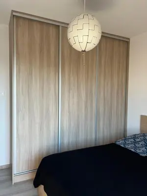 Łóżko lub łóżka w pokoju w obiekcie Apartament Księcia Janusza
