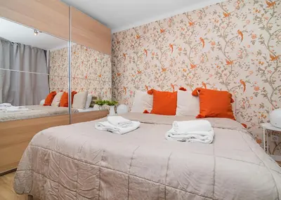 Łóżko lub łóżka w pokoju w obiekcie Central Apartments Grzybowska