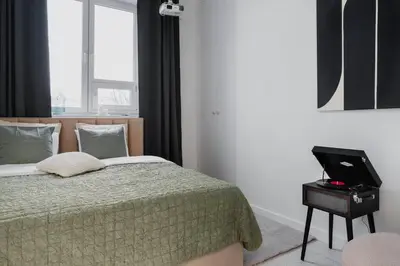 Łóżko lub łóżka w pokoju w obiekcie Warsaw Concierge Praga Centrum