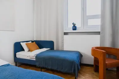 Łóżko lub łóżka w pokoju w obiekcie Warsaw Concierge Praga Centrum