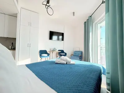 Łóżko lub łóżka w pokoju w obiekcie Apartamenty Wola Tower