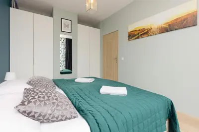 Łóżko lub łóżka w pokoju w obiekcie Sokołowska Apartment Warsaw Wola by Noclegi Renters