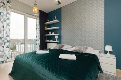 Łóżko lub łóżka w pokoju w obiekcie Sokołowska Apartment Warsaw Wola by Noclegi Renters