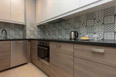 Kuchnia lub aneks kuchenny w obiekcie Sokołowska Apartment Warsaw Wola by Noclegi Renters