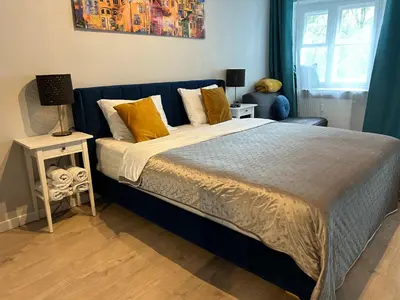 Łóżko lub łóżka w pokoju w obiekcie La Mia Casa STARE MIASTO Warszawa