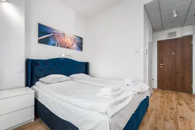 Łóżko lub łóżka w pokoju w obiekcie Kasprzaka 29 B-C by Homeprime