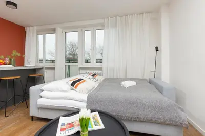 Łóżko lub łóżka w pokoju w obiekcie Modern Studio with Balcony Warsaw Mokotów by Noclegi Renters