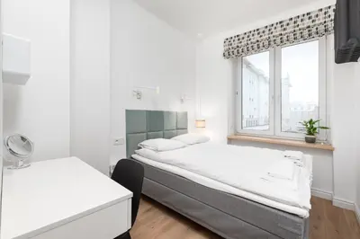 Łóżko lub łóżka w pokoju w obiekcie Apartament Plac Konstytucji by Your Freedom