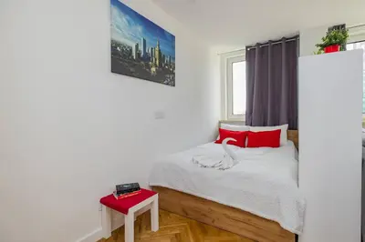 Łóżko lub łóżka w pokoju w obiekcie ShortStayPoland Śliska (B111)