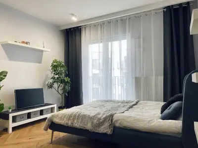 Łóżko lub łóżka w pokoju w obiekcie Wileńska Home apartment 1