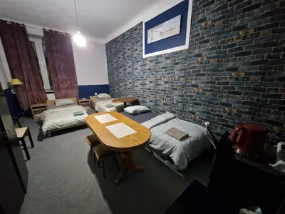 Łóżko lub łóżka w pokoju w obiekcie Retro Centrum