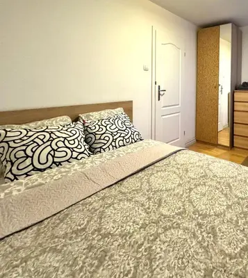 Łóżko lub łóżka w pokoju w obiekcie K22 Apartments Pole Mokotowskie