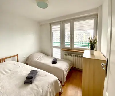 Łóżko lub łóżka w pokoju w obiekcie K22 Apartments Pole Mokotowskie