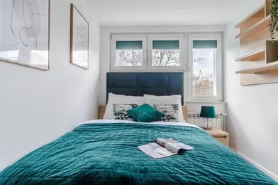 Łóżko lub łóżka w pokoju w obiekcie P&O Apartments Sobieskiego - Mokotów