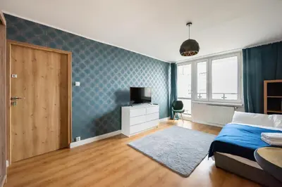 Łóżko lub łóżka w pokoju w obiekcie Praga-Południe Blue Studio by BookingHost