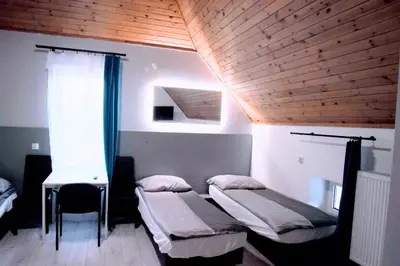 Łóżko lub łóżka w pokoju w obiekcie KOMFORT WILLA+ BIS