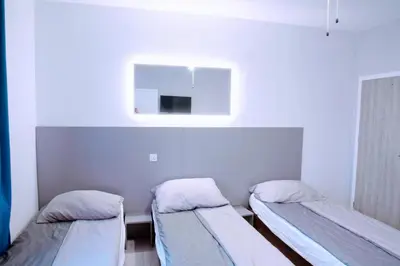 Łóżko lub łóżka w pokoju w obiekcie KOMFORT WILLA+ BIS