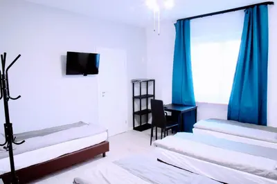 Łóżko lub łóżka w pokoju w obiekcie KOMFORT WILLA+ BIS