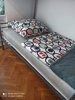 Łóżko lub łóżka w pokoju w obiekcie Hostel Home