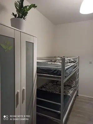 Łóżko lub łóżka w pokoju w obiekcie Hostel Home