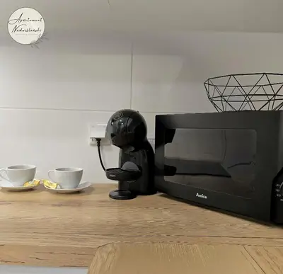 Zestaw do parzenia kawy i herbaty w obiekcie Apartament Nadwiślański
