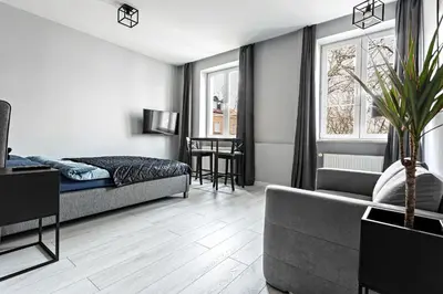 Łóżko lub łóżka w pokoju w obiekcie Quiet Apartment Koscielna Old Town
