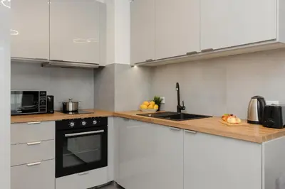 Kuchnia lub aneks kuchenny w obiekcie Cozy Apartments with Parking in the 19th District by Noclegi Renters