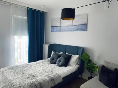 Łóżko lub łóżka w pokoju w obiekcie Wileńska home apartment 2