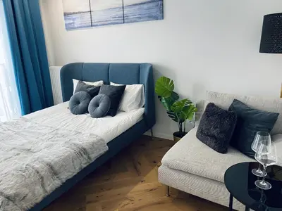 Łóżko lub łóżka w pokoju w obiekcie Wileńska home apartment 2