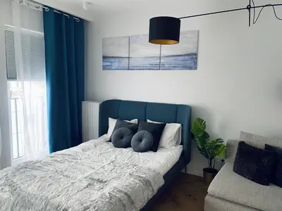 Łóżko lub łóżka w pokoju w obiekcie Wileńska home apartment 2